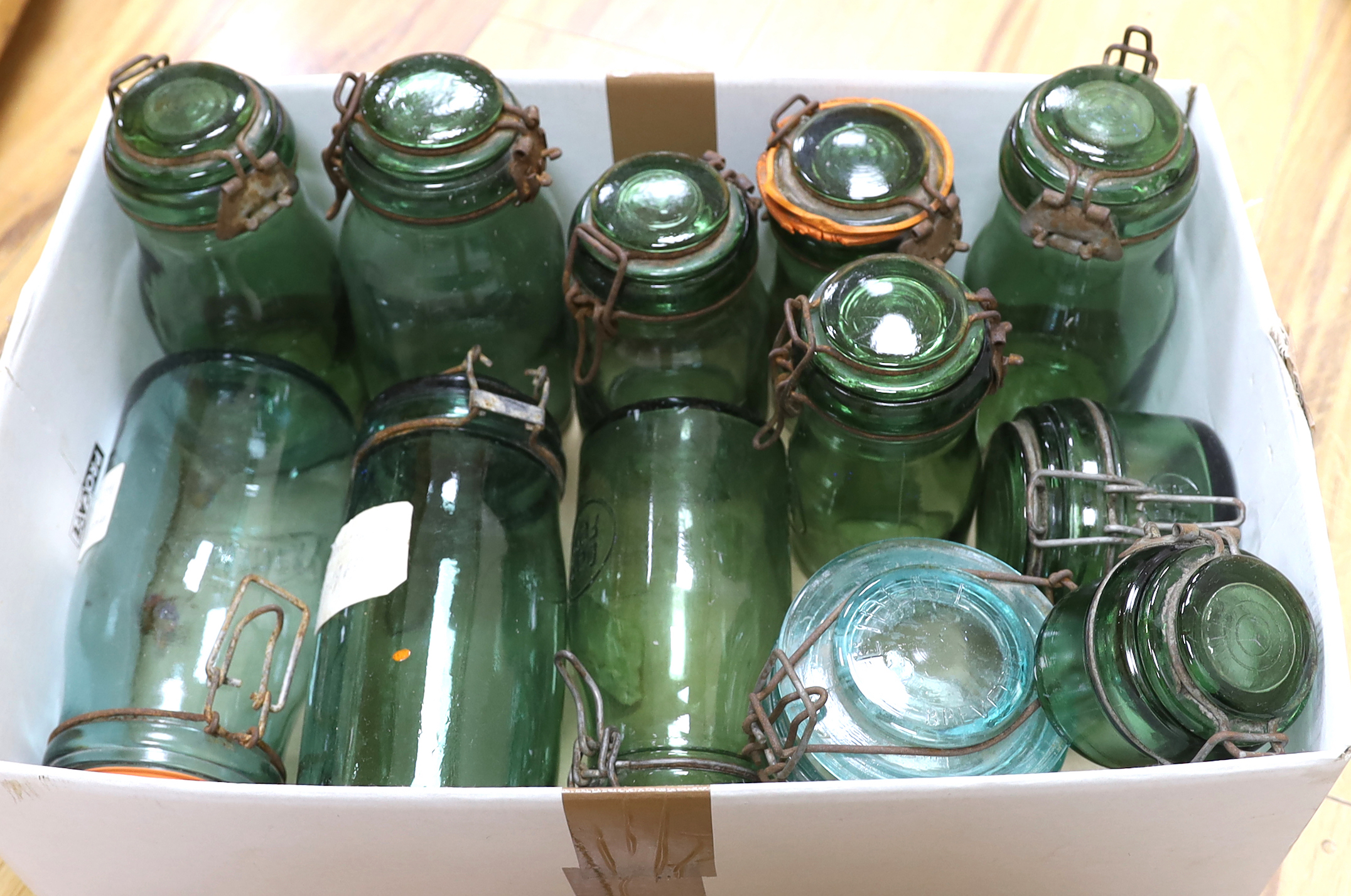 A collection of various sized French green glass storage jars (12)